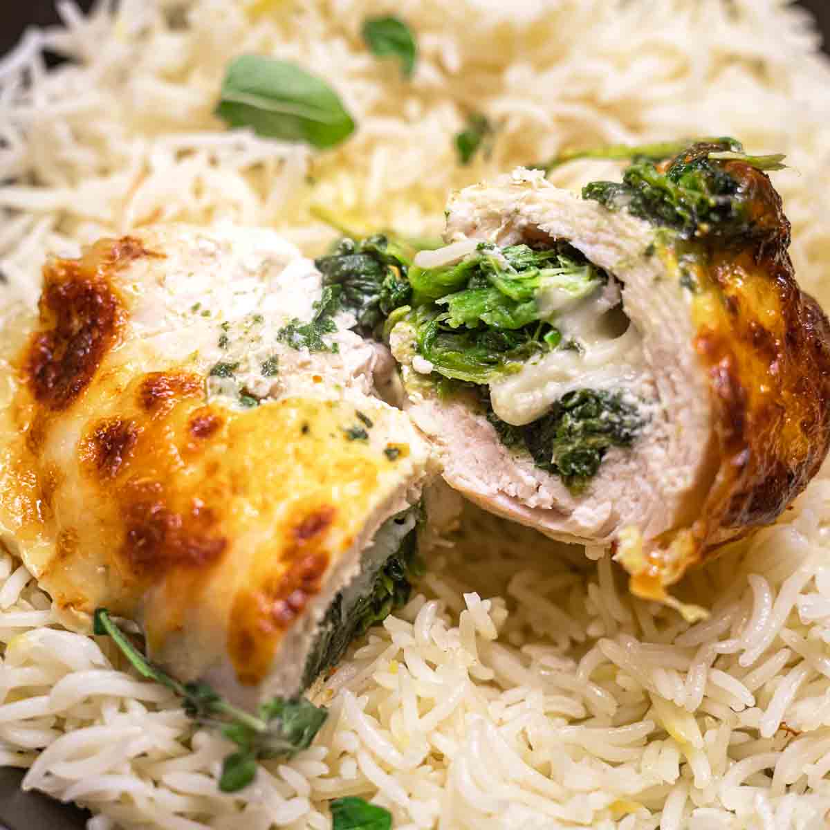 Chicken stuffed with spinach and cheese on rice.