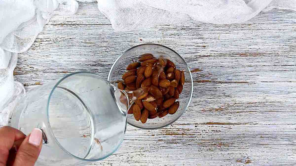 Pouring water onto almonds.