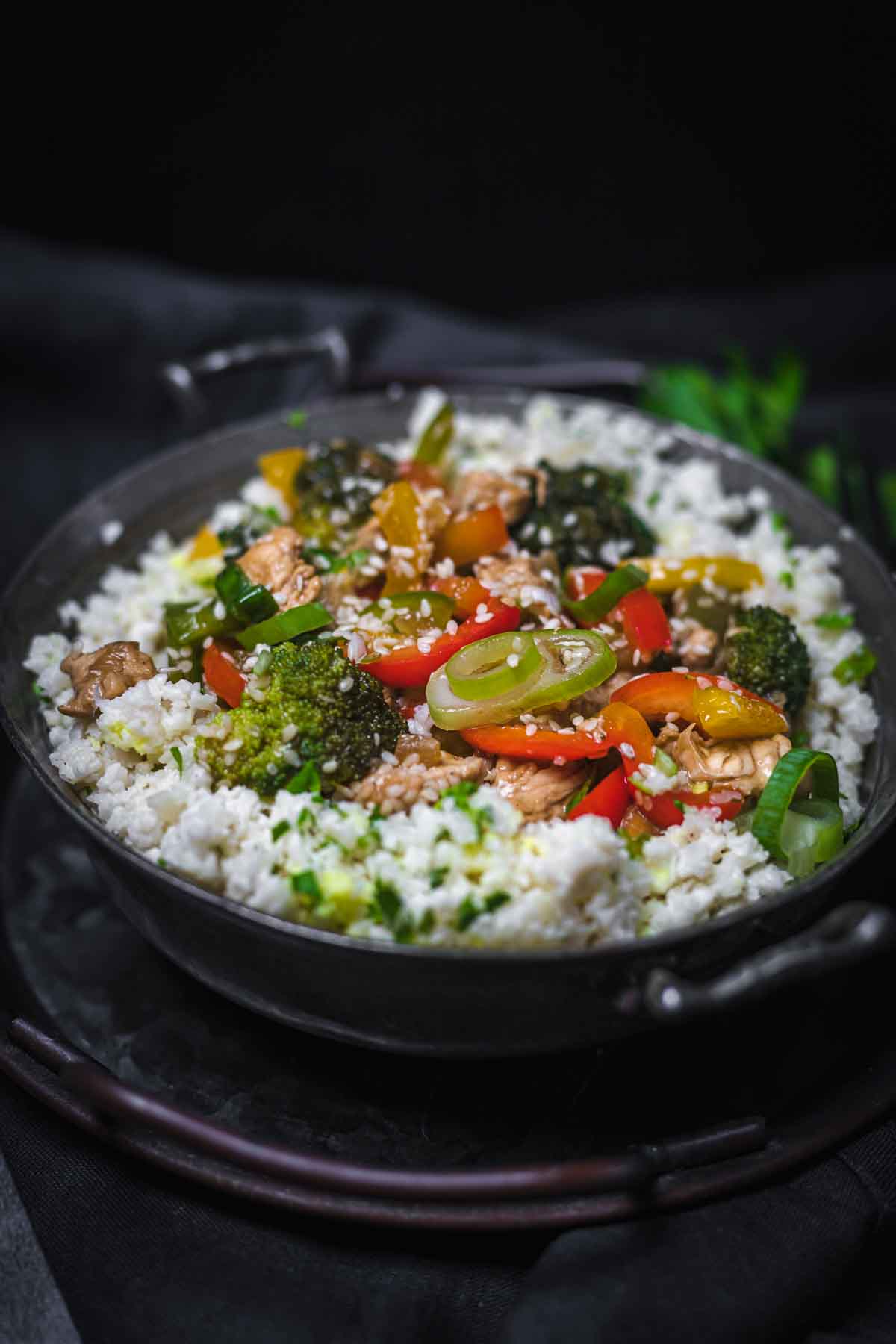 A skillet filled with rice and vegetables.