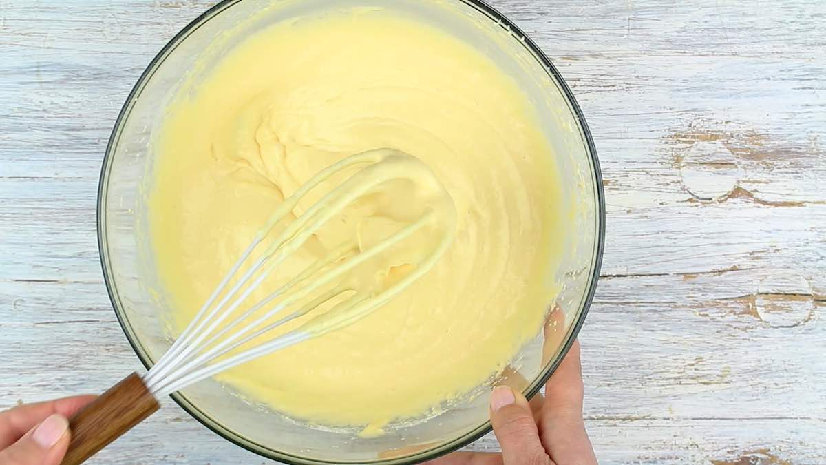 Whisking bread batter in a bowl.