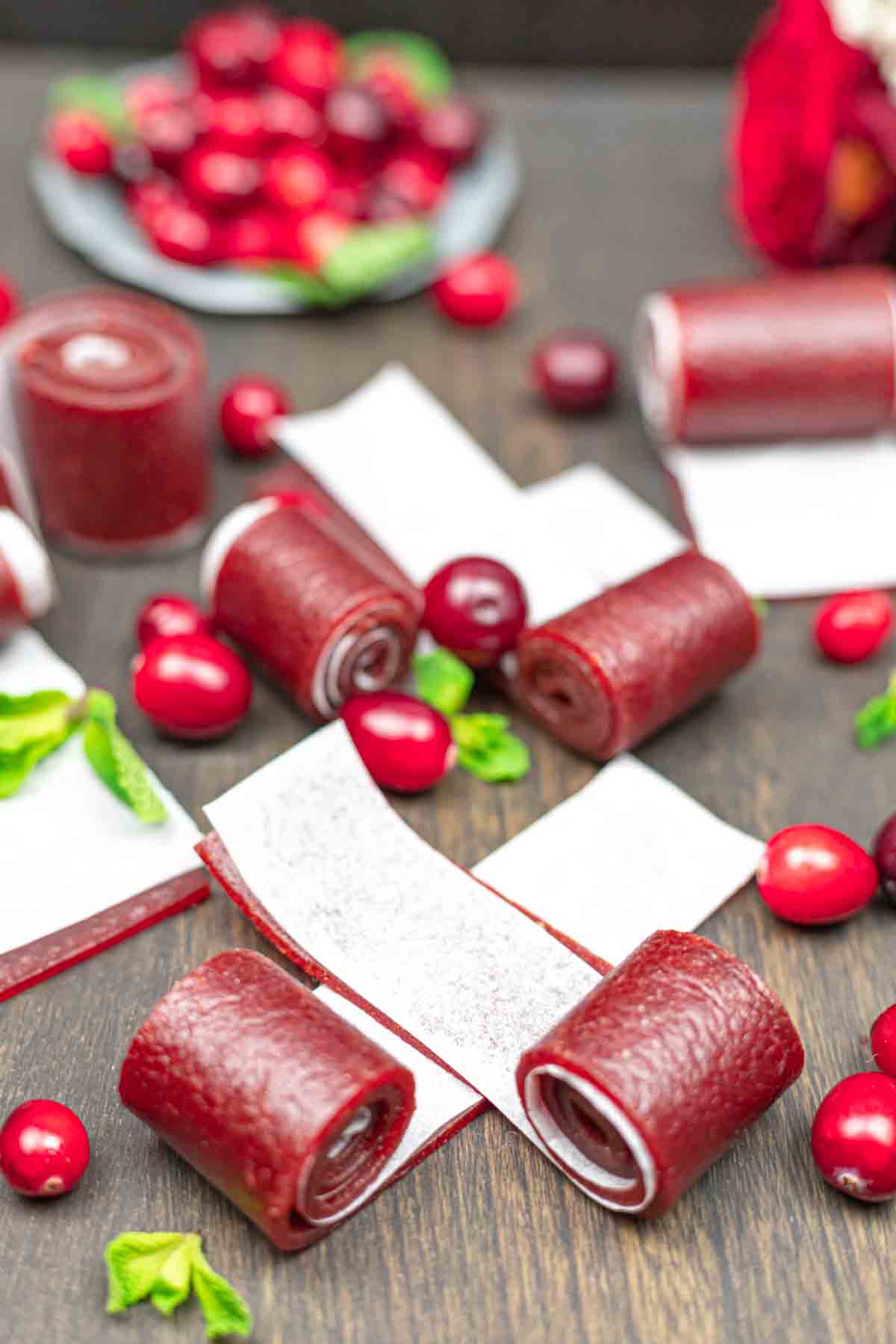 Cranberry roll ups on a wooden table.