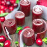 Cranberry roll ups on a table with cranberries.
