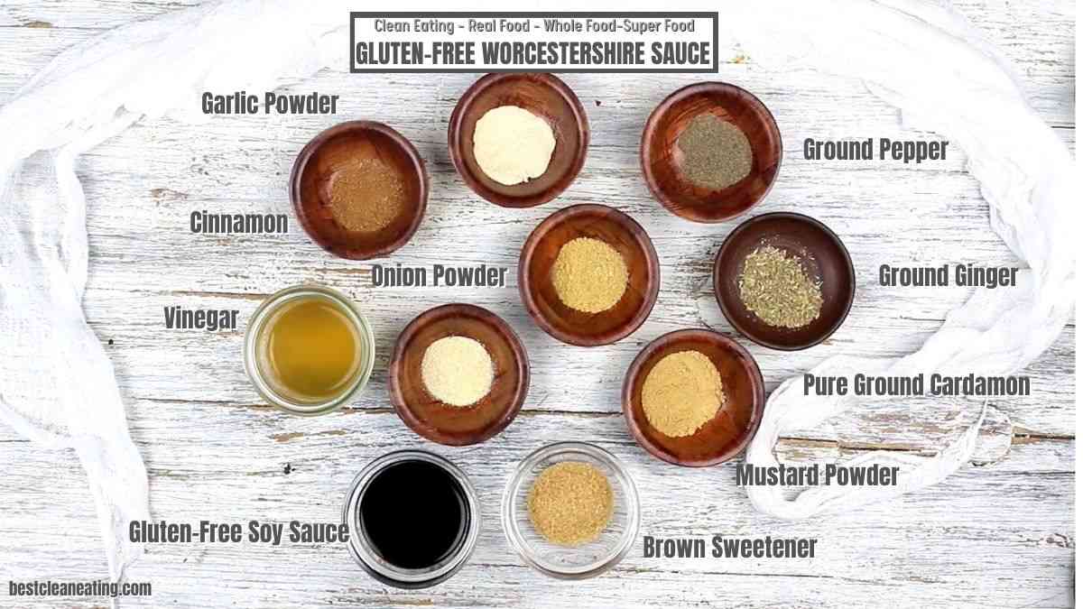 A bowl of spices and herbs on a wooden table.