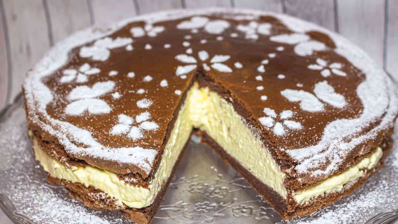 A chocolate cake with a slice taken out of it.