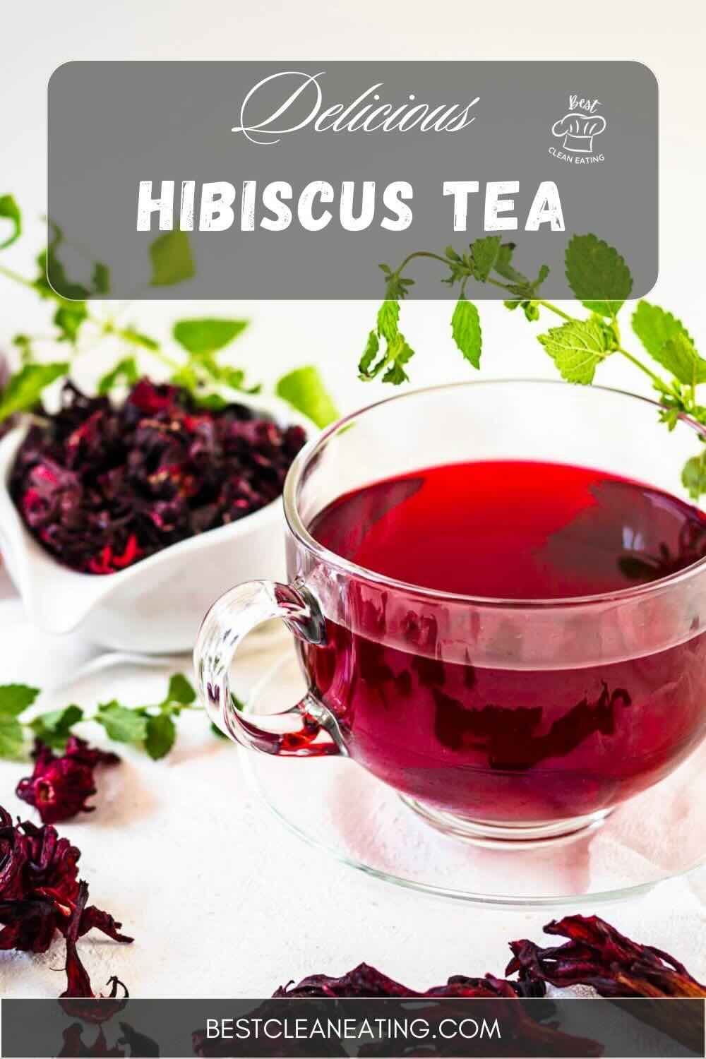 A glass cup of red hibiscus tea next to dried hibiscus petals and fresh green leaves. The text "Delicious Hibiscus Tea" is at the top, with a "Clean Eating" icon and a "bestcleaneating.com" URL at the bottom.