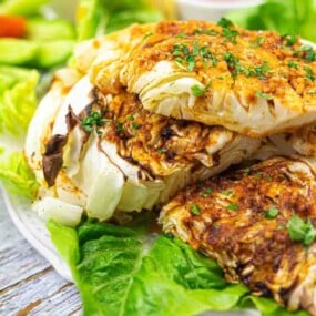 Grilled cabbage wedges seasoned with herbs and spices.