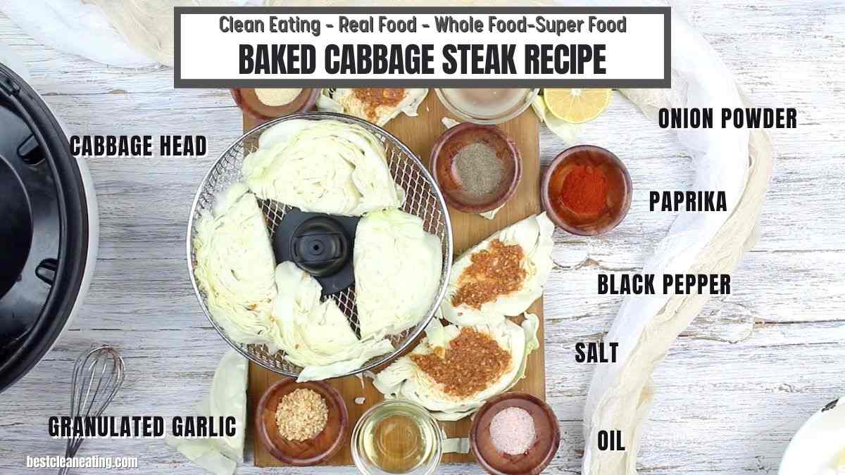 Top view of ingredients for a baked cabbage steak recipe, including a cabbage head, granulated garlic, onion powder, paprika, black pepper, salt, and oil.