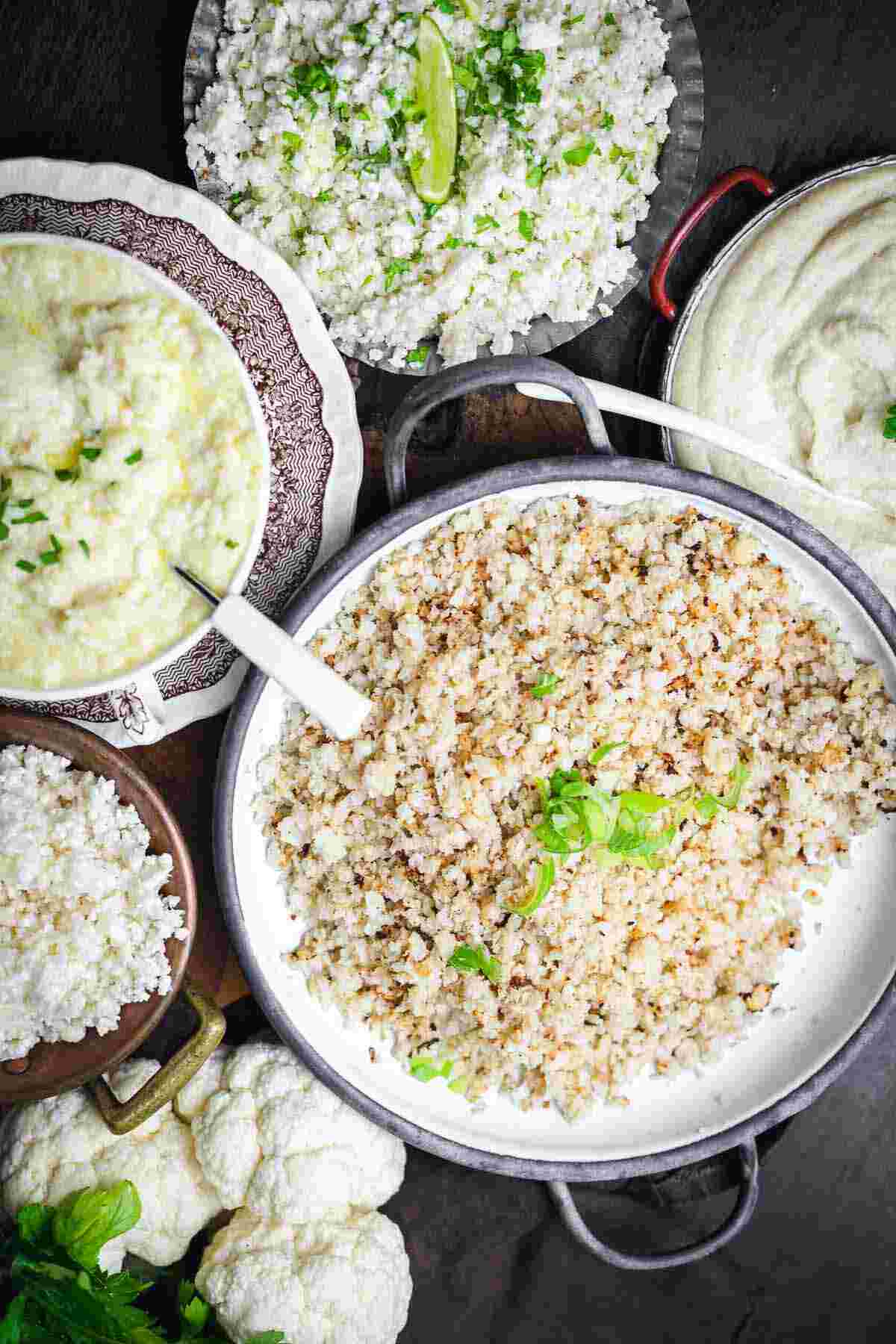 Various cauliflower dishes, including mashed, riced, and whole florets, served in bowls and plates.