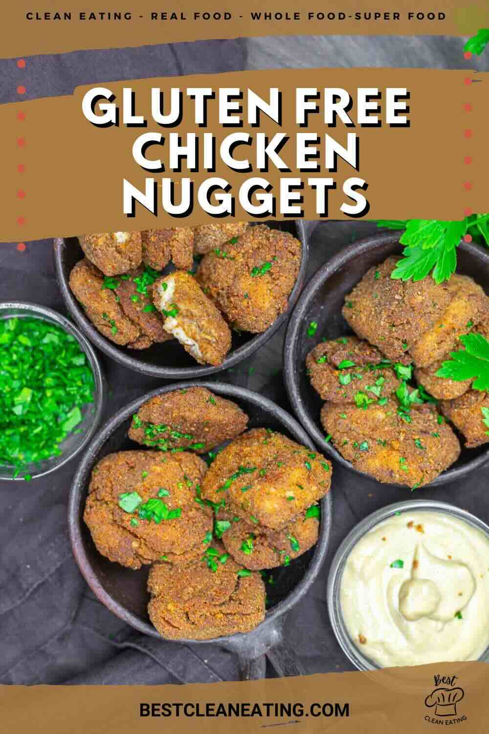 Overhead view of gluten-free chicken nuggets in bowls, garnished with herbs, with a small bowl of dipping sauce and chopped green onions nearby. Text overlay promotes clean eating.