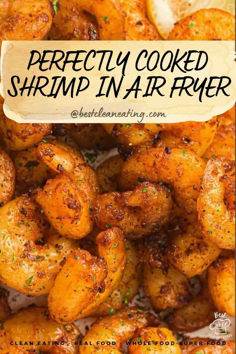 Close-up of seasoned shrimp cooked in an air fryer, with a text overlay that reads "Perfectly Cooked Shrimp in Air Fryer @bestcleaneating.com".