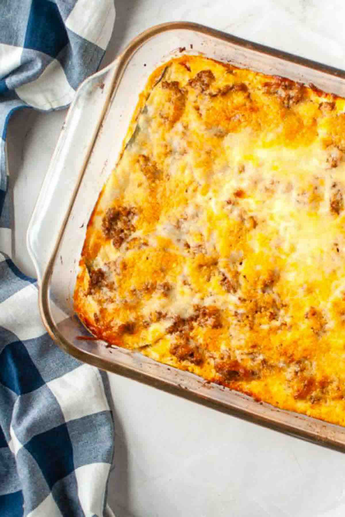 Close-up of cheesy baked zucchini marinara casserole.
