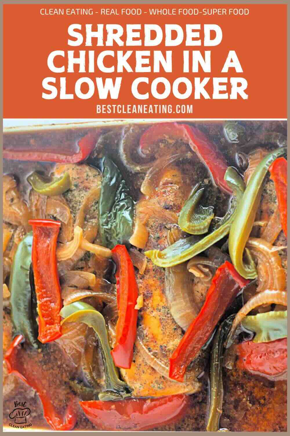 Shredded chicken cooked in a slow cooker with sliced red and green bell peppers and onions, topped with seasonings.