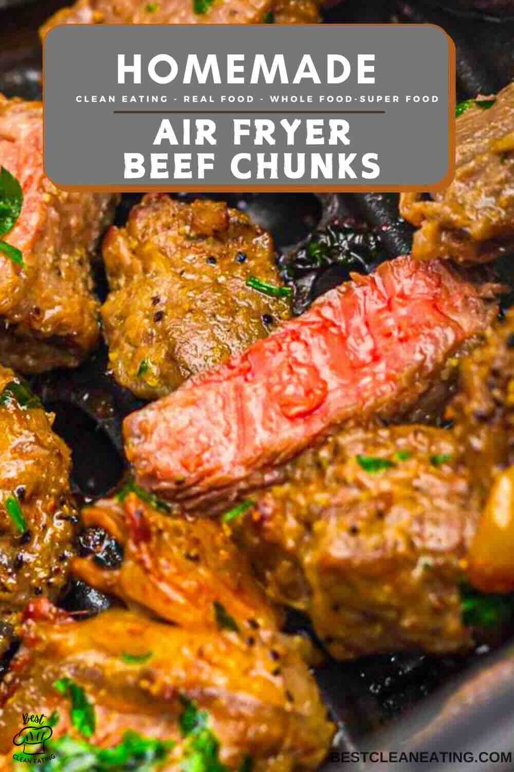 Close-up of cooked beef chunks with a pink center, garnished with herbs, under a label reading "Homemade Air Fryer Beef Chunks.