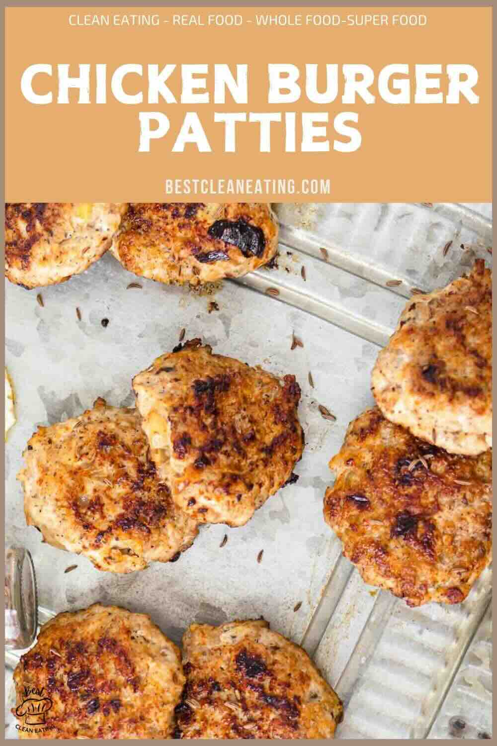 Six cooked chicken burger patties are arranged on a lined baking sheet. The image promotes a recipe from bestcleaneating.com.