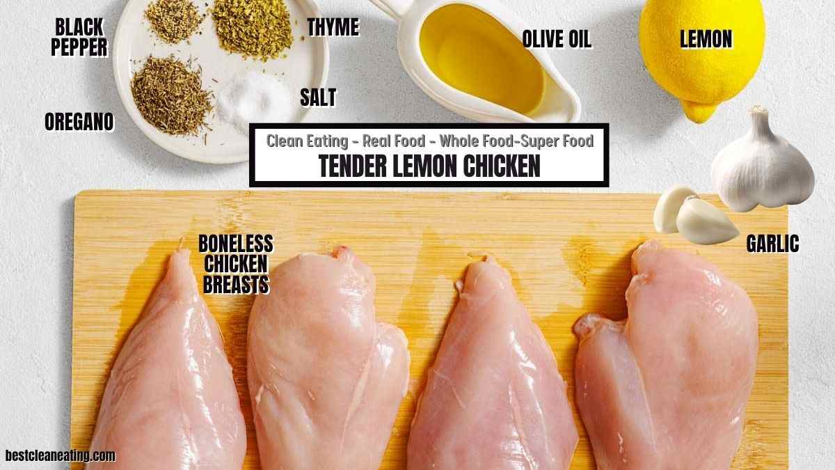 Four raw boneless chicken breasts on a white surface with labeled ingredients: black pepper, oregano, thyme, salt, olive oil, lemon, and garlic.