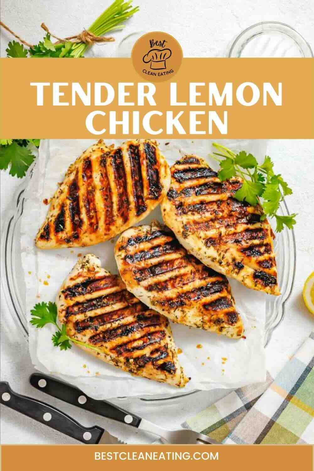 Four grilled chicken breasts with grill marks are arranged on a plate with fresh herbs. Text reads "Tender Lemon Chicken" and "bestcleaneating.com.