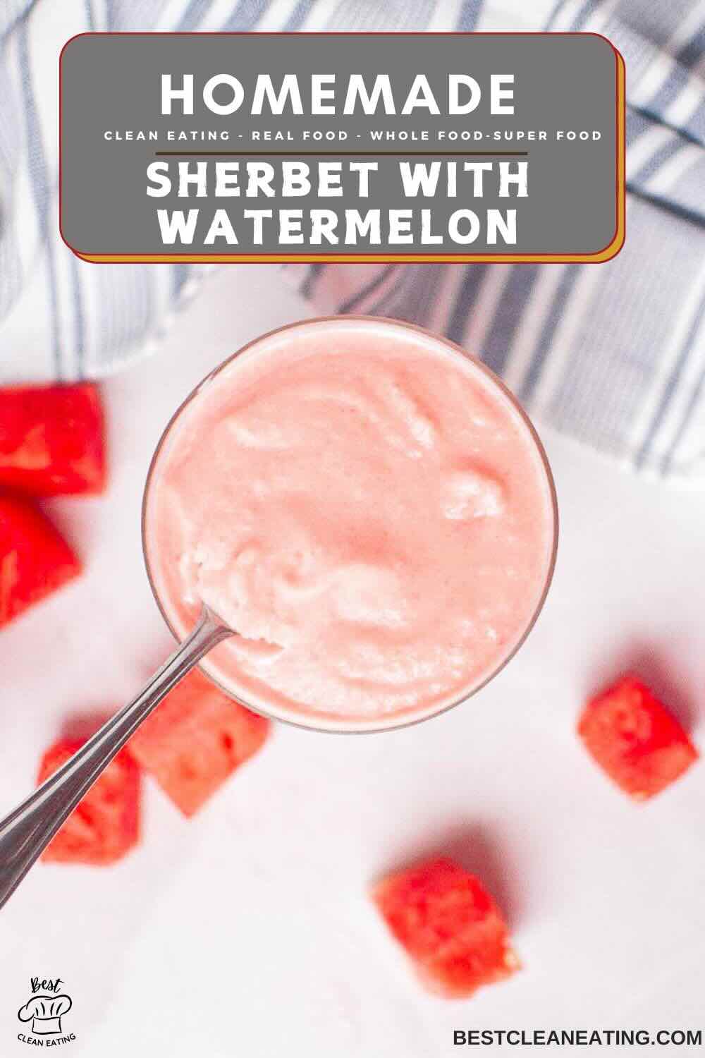 A glass of pink watermelon sherbet with a spoon, surrounded by small watermelon cubes on a white surface. Text overlay reads “Homemade Sherbet with Watermelon.”.