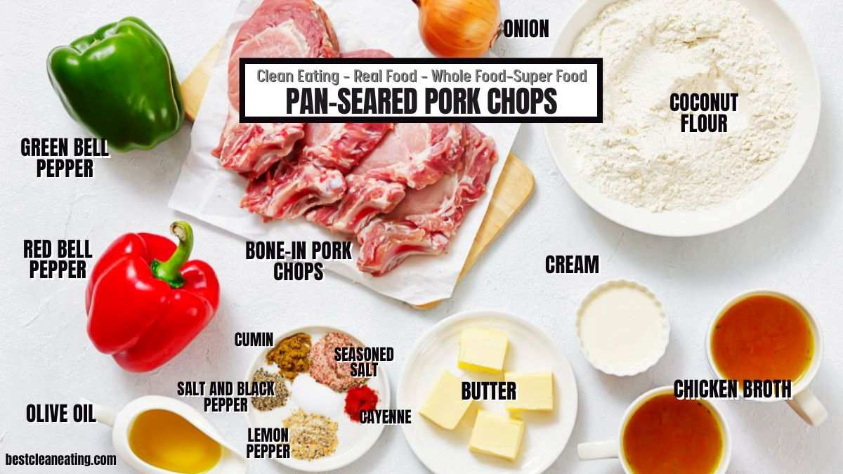 Ingredients for pan-seared pork chops are laid out, including bone-in pork chops, bell peppers, spices, cream, onion, olive oil, butter, coconut flour, and chicken broth.