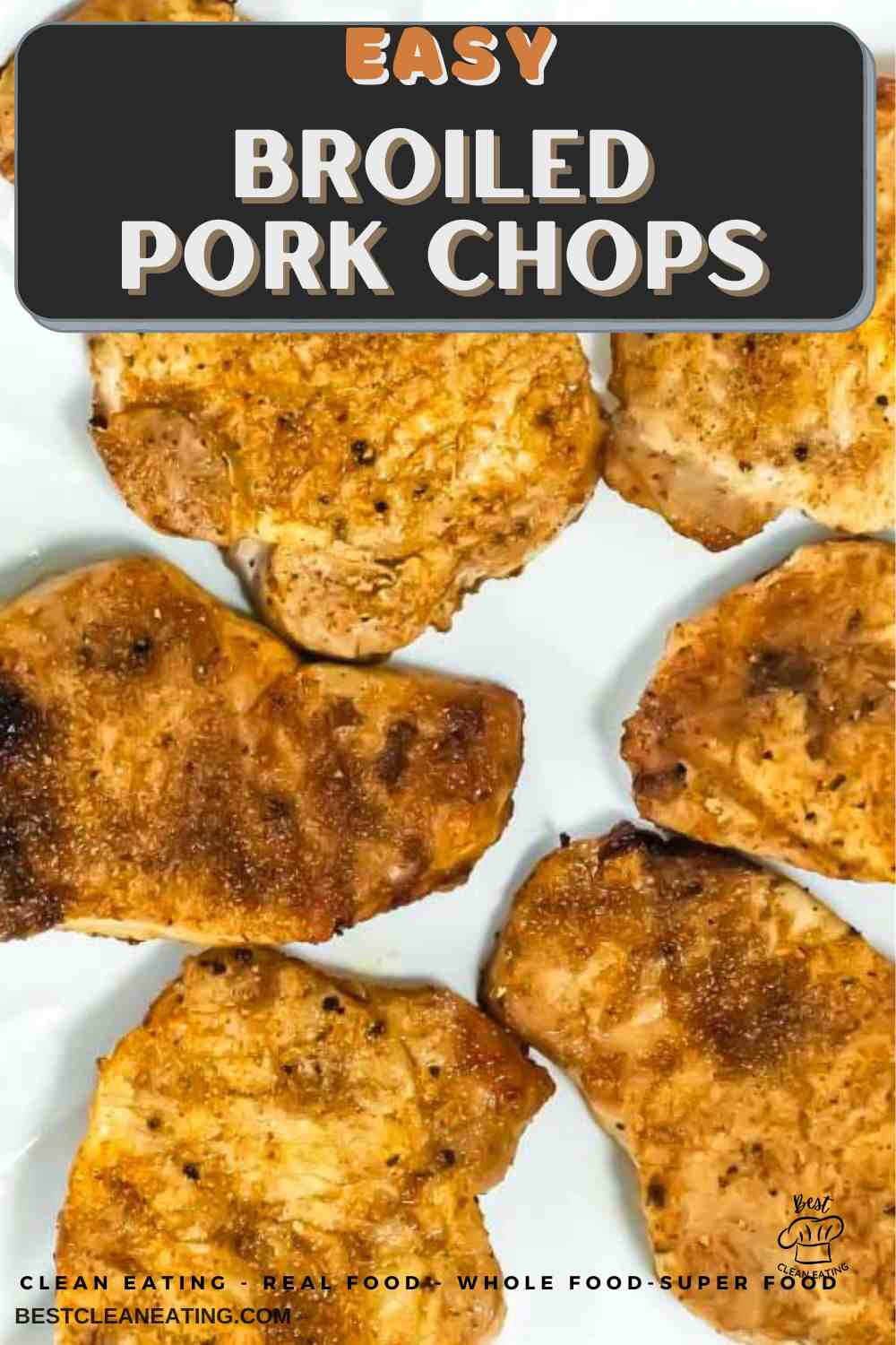 Six seasoned, cooked pork chops arranged on a white surface, with text at the top reading “Easy Broiled Pork Chops.”.