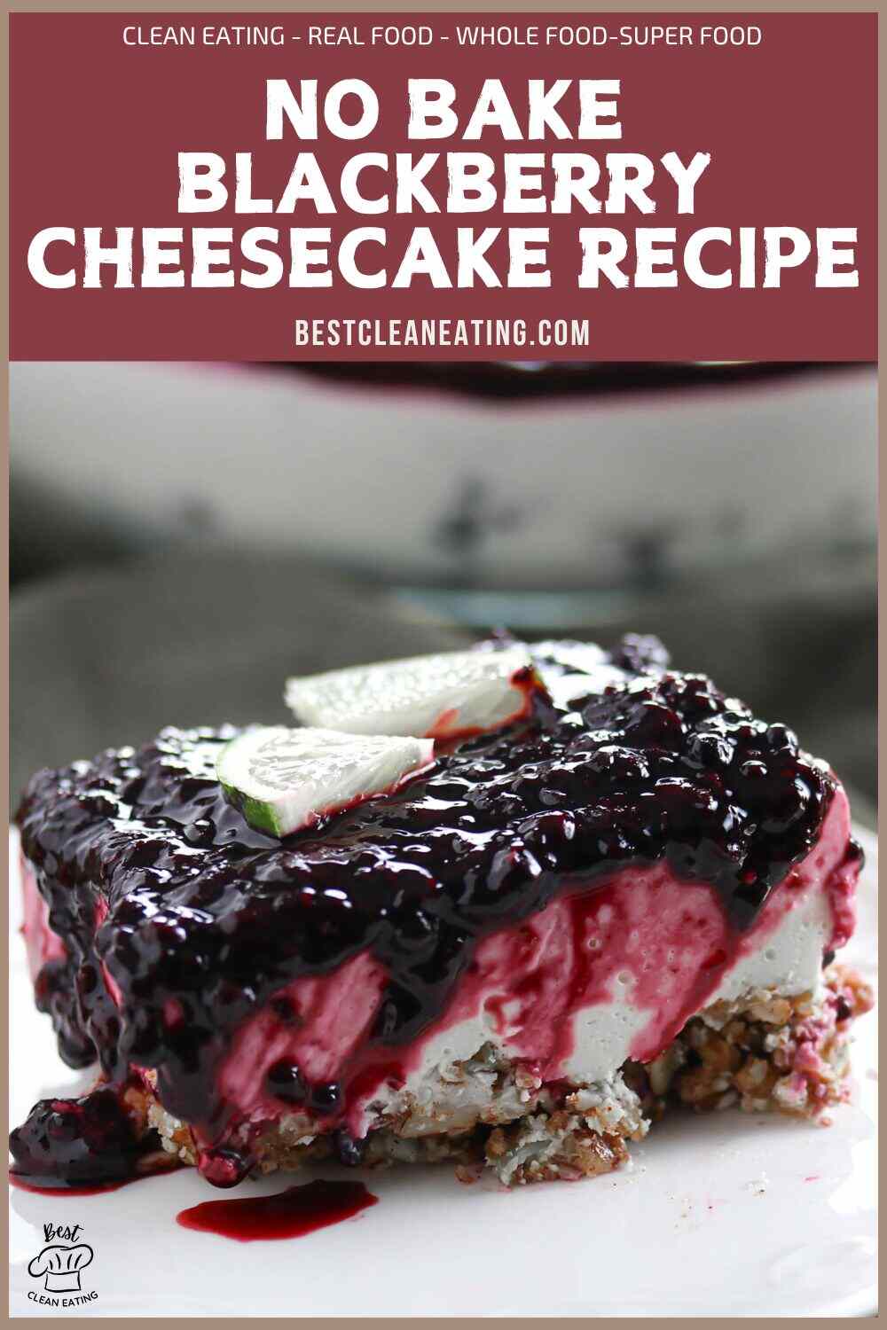 A slice of no bake blackberry cheesecake topped with blackberry sauce and two lime slices, sitting on a nutty crust.